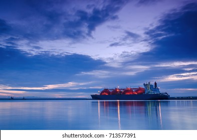 LNG TANKER AT THE GAS TERMINAL - Sunrise over the sea