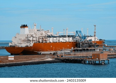 LNG Tanker In The Port At The ISPS Protected Gas Facility. Vessel Designed For Gas Transportation.