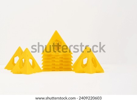 load bearing yellow stackable painters display pyramid triangles isolated on a white background