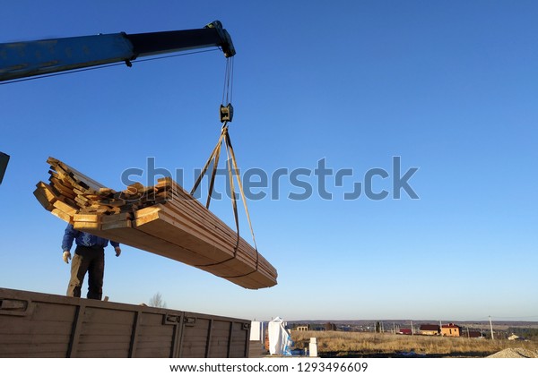 load boards supplied to the construction site
with a crane, manipulator