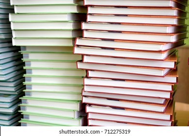 Load of knowledge. A large pile of new books in hardcover