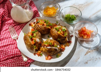 Loaded Baked Potato With Cheddar Cheese Crumbled Bacon Bits Scallions Diced Tomatoes And Ranch Dressing