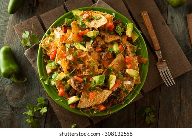 Loaded Beef And Cheese Nachos With Cilantro And Lime