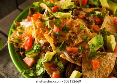 Loaded Beef And Cheese Nachos With Cilantro And Lime