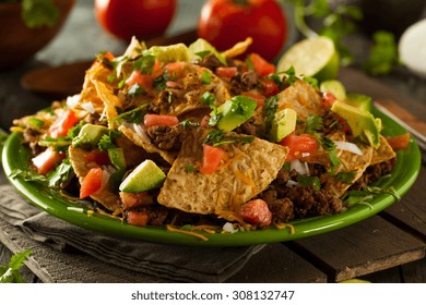 Loaded Beef And Cheese Nachos With Cilantro And Lime