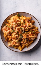 Loaded dirty vegan fries with pickled cabbage, hot mayo and crunchy coconut flakes