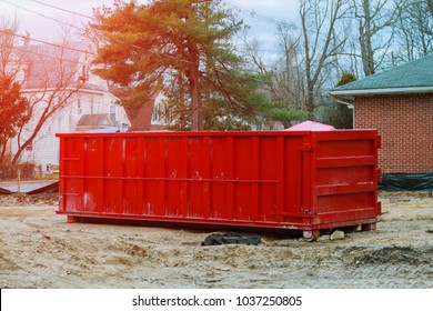 Loaded Dumpster Near A Construction Site, Home Renovation