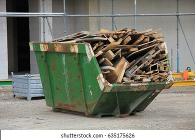 Loaded Dumpster Near A Construction Site, Home Renovation