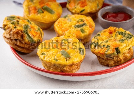 Loaded egg bites with spring vegetables, spinach, carrot, tomato, green beans,  healthy vegan diet food recipe for brunch, breakfast, Simple and quick baked eggs balanced snack