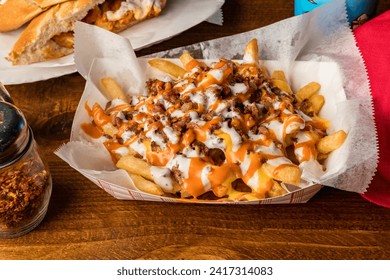 Loaded French fries with bacon, ranch and buffalo sauce - Powered by Shutterstock