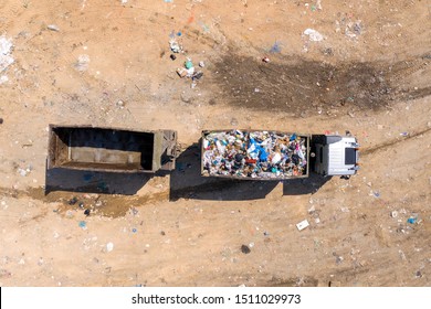 Loaded Garbage Truck At A Municipal Landfill, Top Down Aerial Image.