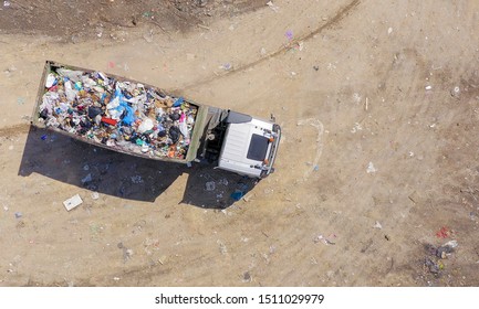 Loaded Garbage Truck At A Municipal Landfill, Top Down Aerial Image.