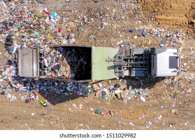 Loaded Garbage Truck At A Municipal Landfill, Top Down Aerial Image.