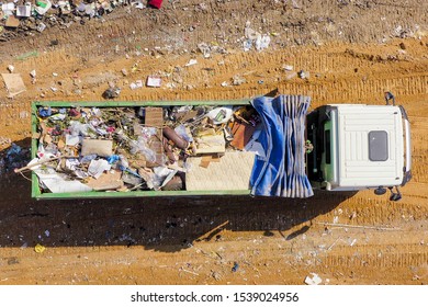 Loaded Garbage Truck At A Municipal Landfill, Top Down Aerial Image.