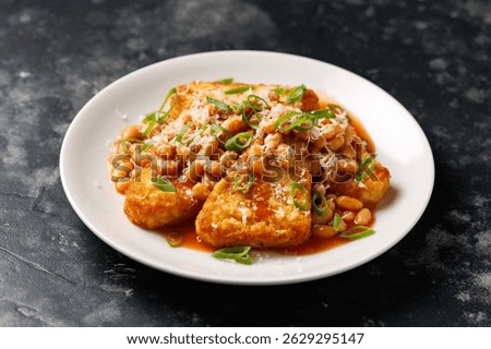 Loaded Hash Browns with baked beans and cheese.