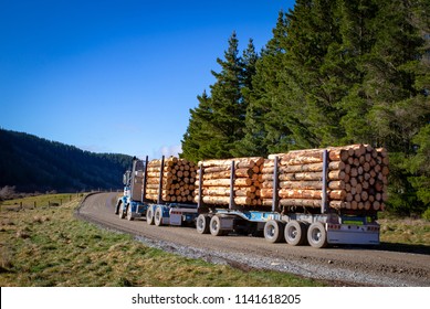 A Loaded Logging Truck Leaves The Forestry Site Ready To Transport Logs To The Sawmill Or For Export