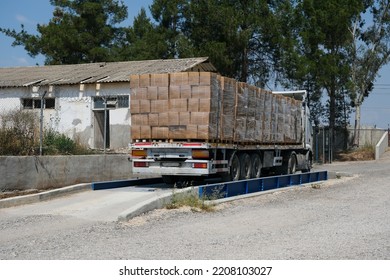 Loaded Trailer Truck On Weigh Bridge