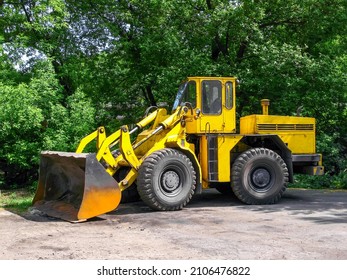 Loader With A Large Bucket Stands At A Ferrous Metallurgy Enterprise 