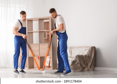 Loaders Carrying Furniture In Flat