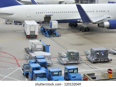 Loading An Aeroplane With Airfreight At An Airport