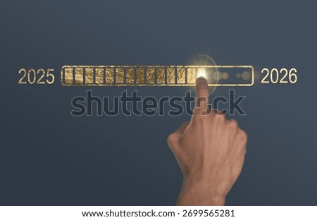 Loading bar in progress. Golden metallic interface with hand of African American man pointing toward 2026 goal, symbol of new year transition, update, and digital development concept.