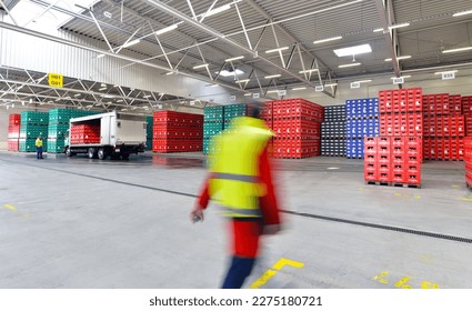 loading of beer crates for trade in a brewery - forklift trucks and trucks in the industrial hall - department store  - Powered by Shutterstock