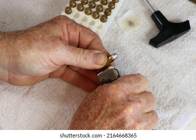 Loading Bullets In A Handgun Magazine