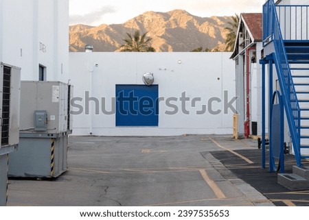 A loading by door on a soundstage in Hollywood California at Golden hour with the Hollywood hills in the background