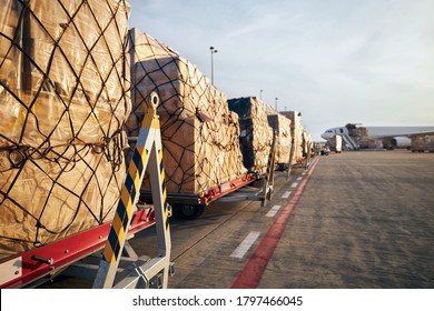 Loading Of Cargo Containers To Airplane At Airport. 