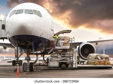 Loading Cargo On Plane In Airport Before Flight