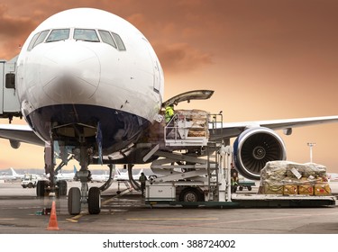 Loading Cargo On Plane In Airport Before Flight