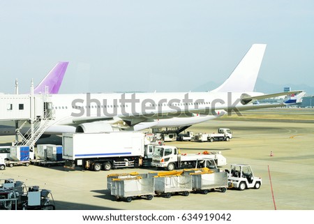 loading cargo to plane at the airport