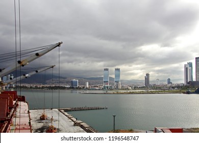 Loading Cargoes Of The Cement Clinker By Ships Cranes In The Port Of Izmir, Turkey.