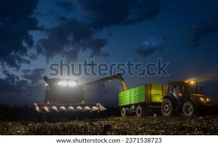 Loading corn into the trailer during the night