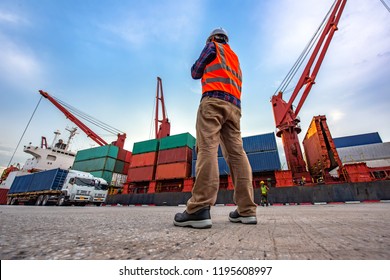 the loading and discharging operation container ship vessel in port takes control by stevedore and foreman in charge, working in port terminal being for logistics and transport services to worldwide