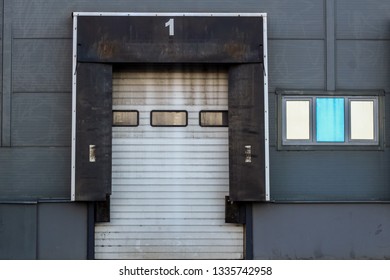 loading docks for trucks at warehouse number one. rolling door