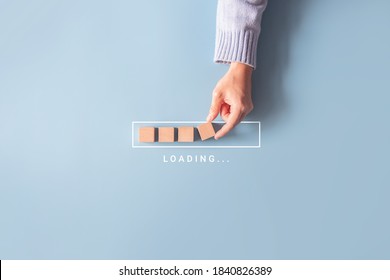 Loading, hand putting wood cube in progress bar. - Shutterstock ID 1840826389