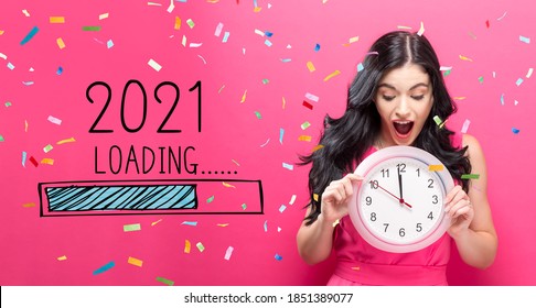 Loading new year 2021 with young woman holding a clock showing nearly 12