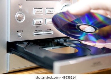 Loading or putting CD medium into player