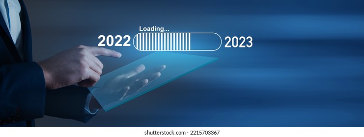 Loading scale from 2022 to 2023. Businessman clicks on the screen - Shutterstock ID 2215703367