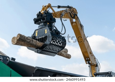 Loading of timber. Loader close up.
