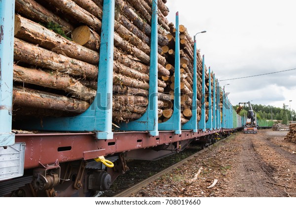 Loading of\
timber on railroad cars. Loader in\
work