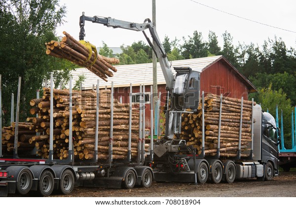 Loading of
timber on railway carriages. Loader in
work
