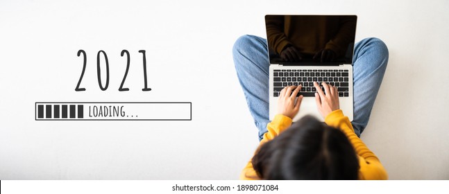Loading trend new year 2021 with woman using laptop computer - Shutterstock ID 1898071084
