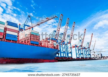 Loading and unloading is underway at the shipping port.