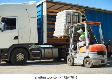 Loading works. Forklift with load and lorry truck - Shutterstock ID 492647845