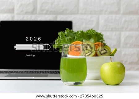 Loading year 2026 for start new business and new life. Healthy  fresh healthy salad and vegetable green water for diet with working in office