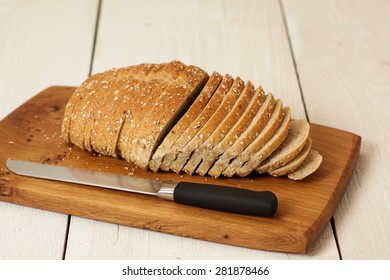 Loaf of bread on a unique cutting board