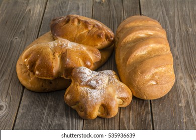 loaf of bread on a wooden table - Shutterstock ID 535936639