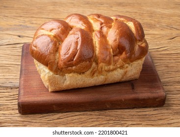 Loaf Of Brioche Bread Over Wooden Table.